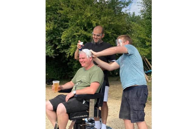 Landlord Mark undergoing the charity head shave. Picture: Mark Newman