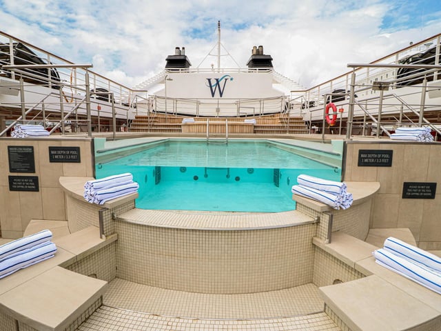 Explore the inside of Star Legend, a luxurious cruise ship operated by Windstar Cruises. Pictured is the outdoor swimming pool.