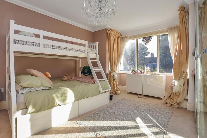 The second bedroom is also a good size, with a double-glazed window to the back of the property. There is a fireplace, which can be restored if the wardrobes are moved.