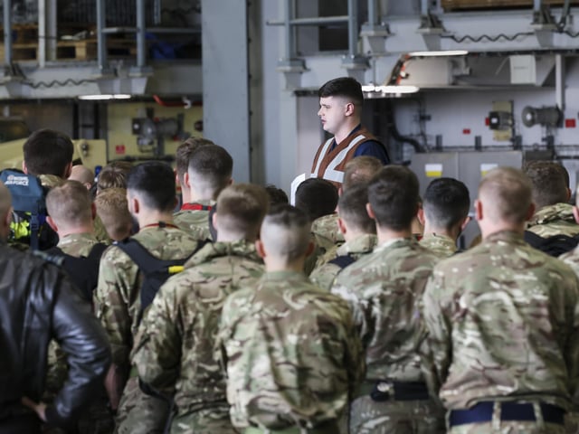 617 "Dambusters" Squadron receive a new joiners brief as they embark the ship in November 2022.