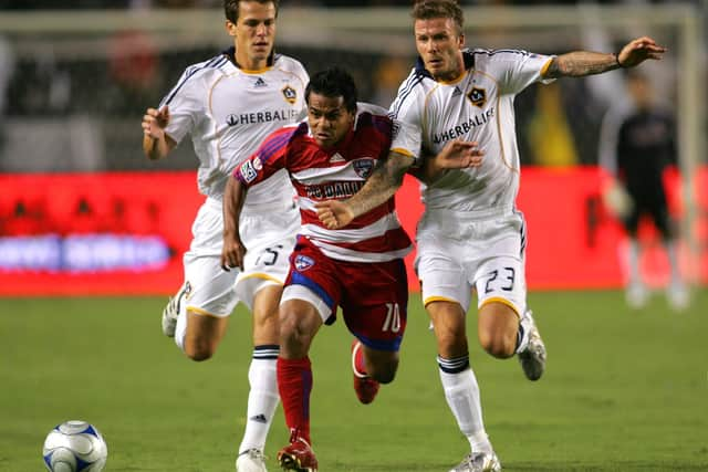 Stefani Miglioranzi (left) and David Beckham were team-mates at LA Galaxy. Here they give chase to FC Dallas' David Ferreira in September 2009. Picture: Victor Decolongon/Getty Images