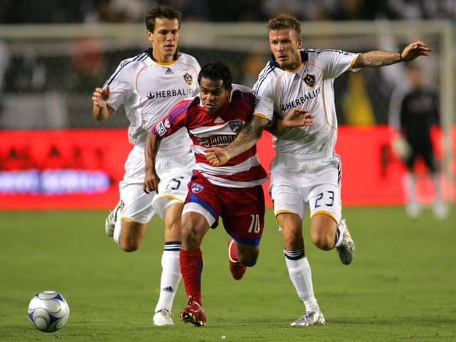 Stefani Miglioranzi (left) and David Beckham were team-mates at LA Galaxy. Here they give chase to FC Dallas' David Ferreira in September 2009. Picture: Victor Decolongon/Getty Images