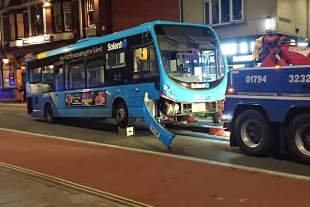 The damaged bus being put onto a recovery vehicle in London Road, Hilsea, at 8.17pm last night.