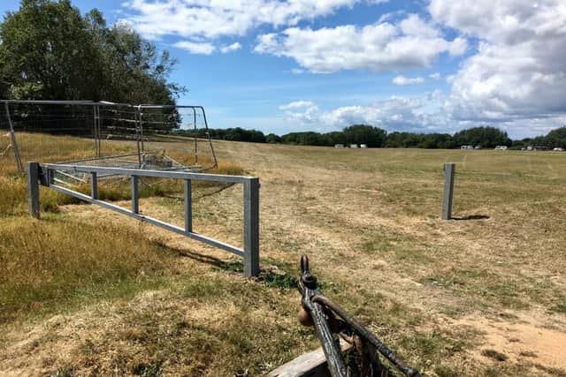 Travellers have parked more than two dozen caravans in a field in Port Solent, with a barrier blocking access to the site found broken.