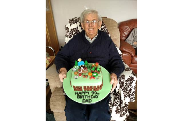 Maurice Walker with his special cake on his 90th birthday.