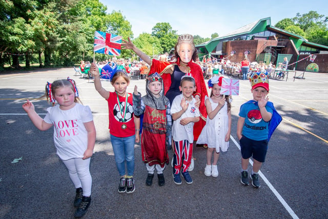 Dollie, 6, Isbelle 8, Zac 7, Oscar 8, Molly, 6 and Joshua, 6, with headteacher Jo Livingstone as The Queen at Springwood Federation, Waterlooville having a lunch party