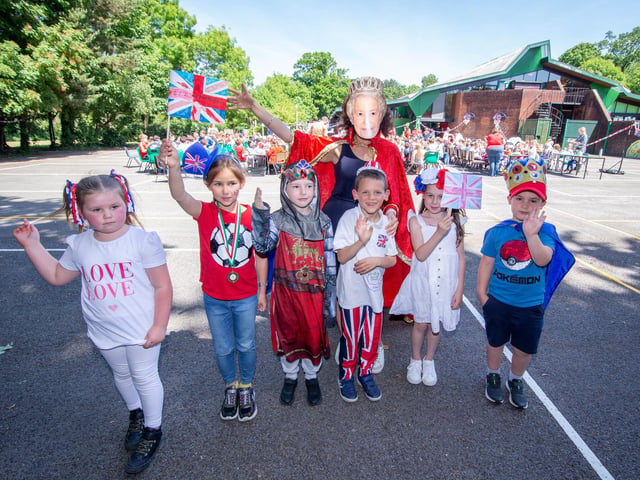 Dollie, 6, Isbelle 8, Zac 7, Oscar 8, Molly, 6 and Joshua, 6, with headteacher Jo Livingstone as The Queen at Springwood Federation, Waterlooville having a lunch party