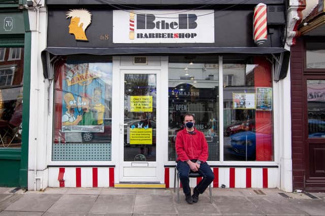 Mike Yeoman waiting to get his haircut outside Bob the Barbershop, Albert Road. Picture: Habibur Rahman