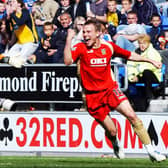 Matt Taylor celebrates Benjani's equaliser at Wigan in the April 2006 match which would keep Pompey in the Premier League. Picture: Steve Reid.