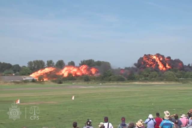 Undated Handout file video grab issued by Sussex Police and the Crown Prosecution Office of the aircrash during the Shoreham Airshow on August 22 2015 where Pilot Andrew Hill was performing a stunt in a 1950s Hawker Hunter before it plummeted onto the A27 in West Sussex and exploded into a fireball killing 11 men Picture: Sussex Police/CPS/PA Wire