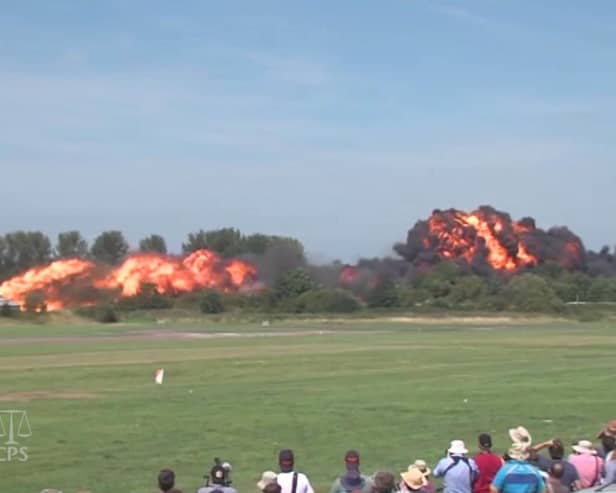 Undated Handout file video grab issued by Sussex Police and the Crown Prosecution Office of the aircrash during the Shoreham Airshow on August 22 2015 where Pilot Andrew Hill was performing a stunt in a 1950s Hawker Hunter before it plummeted onto the A27 in West Sussex and exploded into a fireball killing 11 men Picture: Sussex Police/CPS/PA Wire