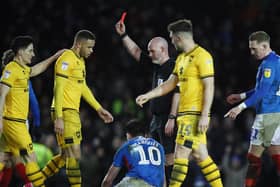 Carlton Morris was sent off for MK Dons after bringing down Pompey striker John Marquis. Picture: Joe Pepler