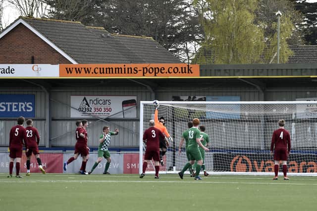 Burrfields keeper Dwayne Gray makes a fingertip save against Mob Albion. Picture: Allan Hutchings