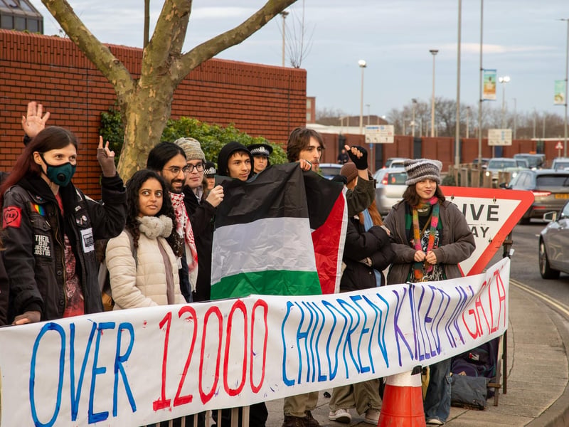 Demonstrators outside Unicorn Gate make their views known
Photos by Alex Shute