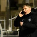 Joe Gallen on the phone to Kenny Jackett during last night's 3-1 defeat at Bristol Rovers. Picture: Graham Hunt/ProSportsImages
