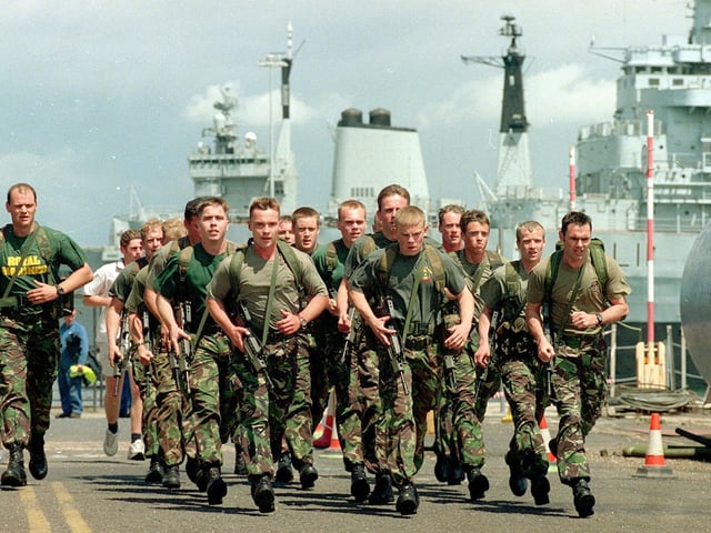 Royal Marines from HMS Fearless take part in the Round the Basin Run, organised by FSL at the Dockyard.Picture: Luke MacGregor 012979_Race