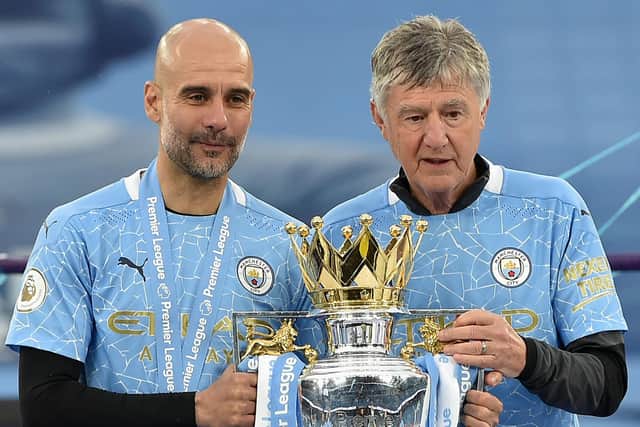 Brian Kidd and Pep Guardiola with the Premier League trophy they won with Manchester City in 2020-21. Picture: Peter Powell - Pool/Getty Images