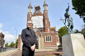 St John's Roman Catholic Cathedral in Bishop Crispian Way, Portsmouth, is undergoing urgent maintenance to one of its historic windows. The window has been removed to be painstakingly restored - as it was at risk of "total collapse".

Pictured is: The Dean of the Cathedral Father James McAuley.

Picture: Sarah Standing (140723-6566)