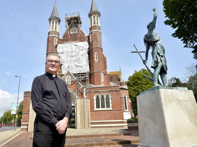 St John's Roman Catholic Cathedral in Bishop Crispian Way, Portsmouth, is undergoing urgent maintenance to one of its historic windows. The window has been removed to be painstakingly restored - as it was at risk of "total collapse".

Pictured is: The Dean of the Cathedral Father James McAuley.

Picture: Sarah Standing (140723-6566)