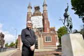St John's Roman Catholic Cathedral in Bishop Crispian Way, Portsmouth, is undergoing urgent maintenance to one of its historic windows. The window has been removed to be painstakingly restored - as it was at risk of "total collapse".Pictured is: The Dean of the Cathedral Father James McAuley.Picture: Sarah Standing (140723-6566)