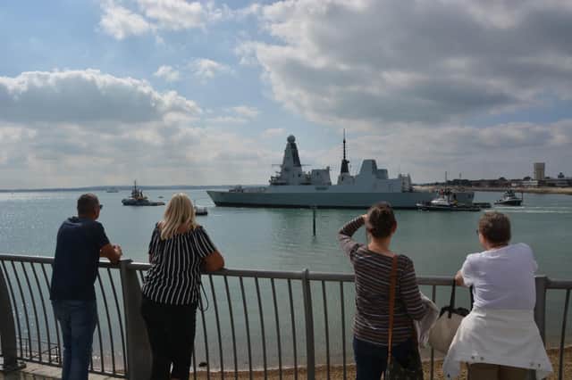 Billion-pound warship HMS Daring, which has not been at sea since 2017, being towed from Portsmouth Naval Base for a multi-million pound engine refit which is being carried out to all of the Royal Navy's Type 45 destroyer. Picture date: Wednesday September 15, 2021. PA Photo. Picture: Ben Mitchell/PA Wire