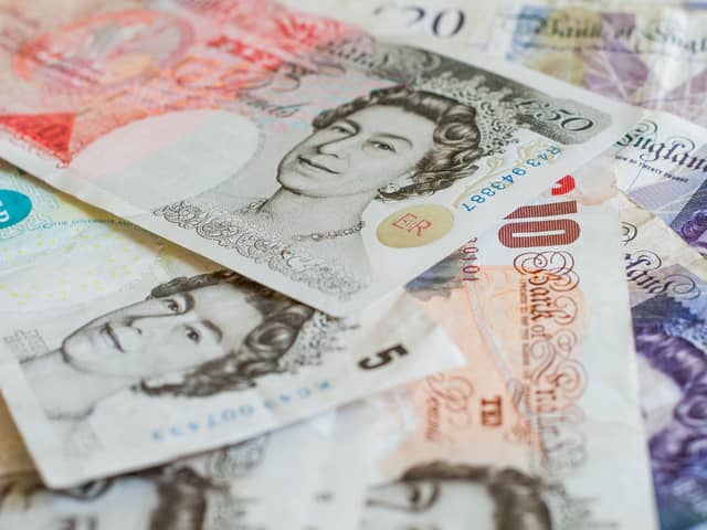 File photo of a pile of pound sterling notes