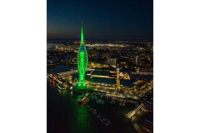 The tower all lit up in green - though it will not be repainted as part of the partnership