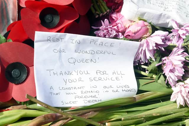 Floral tributes on the Portsmouth Guildhall steps in Guildhall Square, Portsmouth, on Monday, September 12.

Picture: Sarah Standing (120922-3226)
