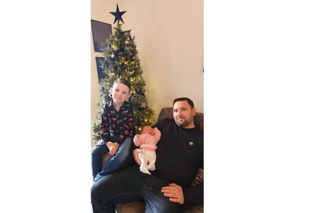 Lara Elloise Sandells, with big brother Harry, six, and dad Daniel