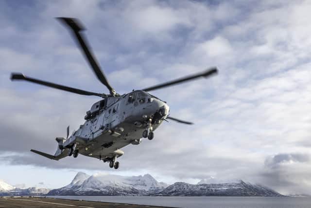 Pictured: Royal Navy Merlin Mk4 landing on board the Amphibious Assault Ship, HMS Albion whilst on deployment in Norway for Exercise Cold Response.
HMS ALBION AND EXERCISE COLD RESPONSE IN NORWAY
Exercise Cold Response 2022 is the winter deployment in Norway directing Commando Forces to establish the cold weather skills, both individual and collective, to deliver success on Cold Response. The conclusion of this shaping activity, force elements will be located in the north of Norway, at multiple locations, and afloat. UK Commando Force (UKCF) will aggregate and rehabilitate all force elements ready to commence Cold Response. The scenario will be used as the geopolitical construct for the exercise, with
UKCF conducting Advance Force Operations to enable NATO partner nations, at Littoral Strike Group scale.
