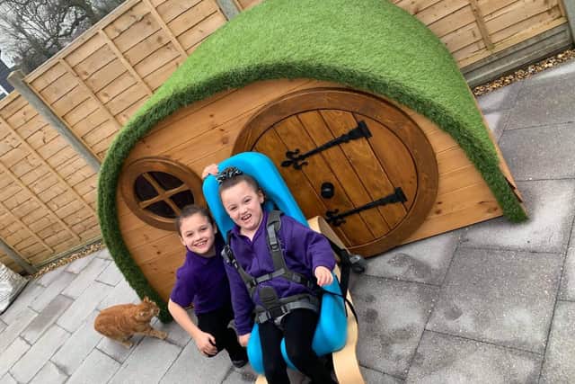 Olivia and Gracie Millerchip's new playhouse that was donated by PS Timber