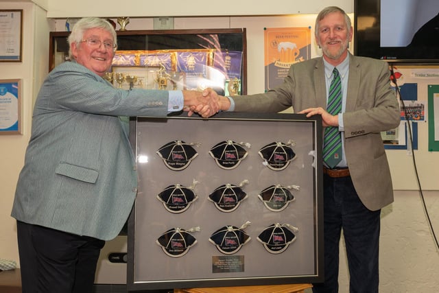 Mike Smith from the Hockey Museum presents framed GB caps to Havant chairman Chris Pickett. Picture: Keith Woodland