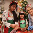 Resident Vicki Mungur, 90, joined by local Fleet children Grace,11, and Aviana, 6