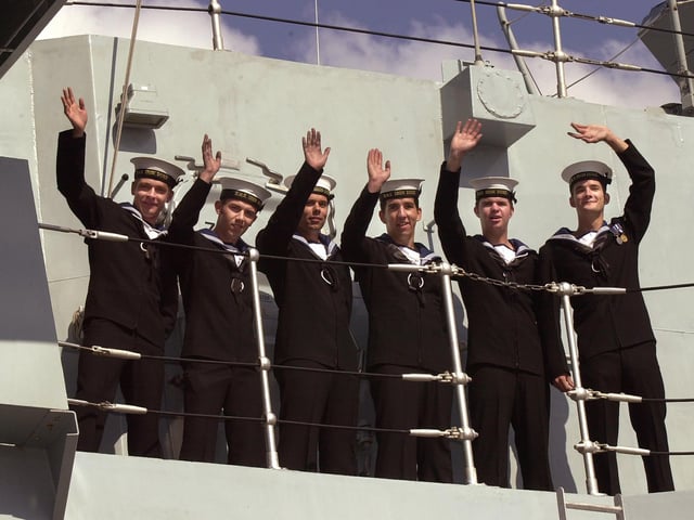 The homecoming of HMS Iron Duke to Portsmouth Naval Base 22nd August 2003. Sailors on board HMS Iron Duke wave to the waiting families on the quayside as they come alongside PICTURE: MALCOLM WELLS ( 034194-100 )