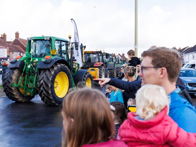 Crowds gathered in Wickham Square to watch the procession of tractors go by all to raise money for Rowans Hospice and Guide Dogs.