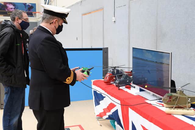 Commander Mark Walker, a pilot by trade, pictured at a model helicopter display at HMS Collingwood during his retirement celebration.Photo: Keith Woodland