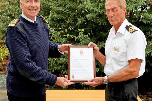 First Sea Lord, Admiral Tony Radakin, presenting a Gold Valedictory Certificate to Lt Cdr Al Cronin MBE.

Picture: Royal Navy