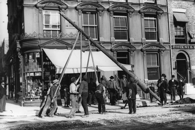 1902:  Men erecting a traction pole at the King's Road junction during the electrification of the Portsmouth tram system.  (Photo by Hulton Archive/Getty Images)