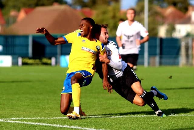 Kyal Williams is brought down by a North Leigh opponent. Picture by Tom Phillips