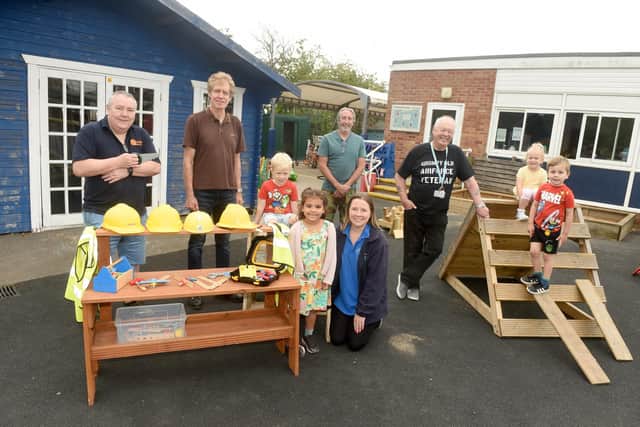 Back, from left: Havant Men's Shed Leigh Watton, Phil Hebblethwaite, Mike Skelton and Cavan O'Beirne. Front, from left: Blake Boyce (four), Amelia Guedeney (four), Sarah Hennessy, nursery teacher, Ezra Lindley (four) and Max Takacs (three). Picture: Sarah Standing (240622-855)