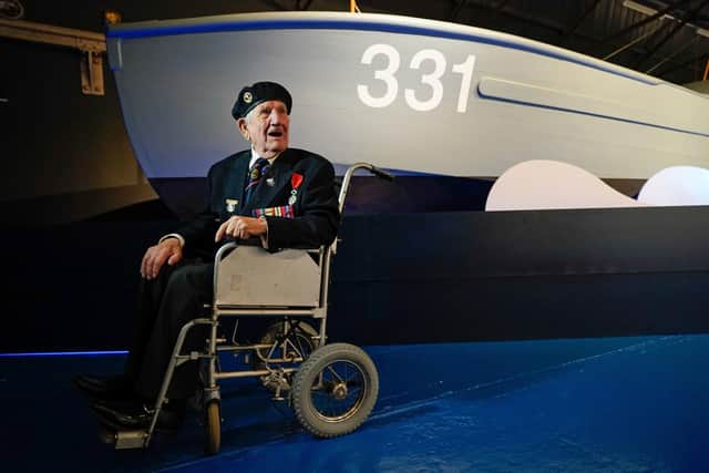 Second World War Coastal Forces veteran George Chandler, 96, who served as an Able Seaman on MTB 710, in front of MTB 331 at The Night Hunters: The Royal Navy's Coastal Forces at War exhibition at the Explosion Museum of Naval Firepower in Gosport Picture: Andrew Matthews/PA Wire