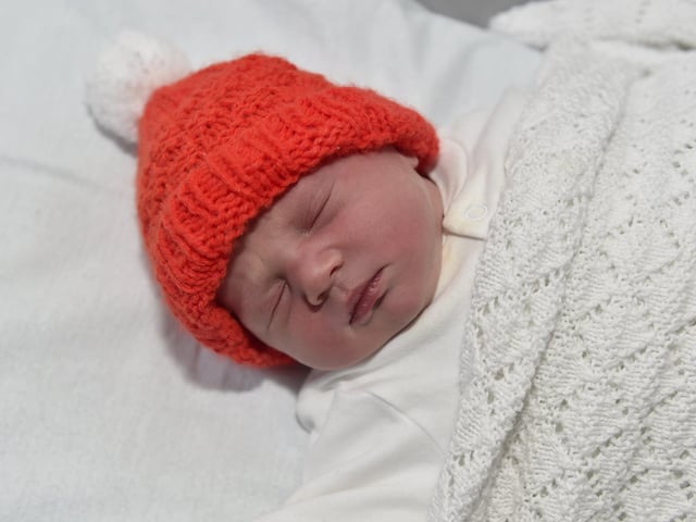 Eva Cooke born on Christmas Day at 7.38am weighing 6lb 14oz to parents Charlotte and Sam Cooke both 34 from Bournemouth. Eva was born via a surrogate from Havant. Picture: Sarah Standing (261223-4100)