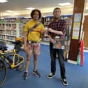 Joseph Coelho gets his library card from North End Library supervisor Grant Nelson