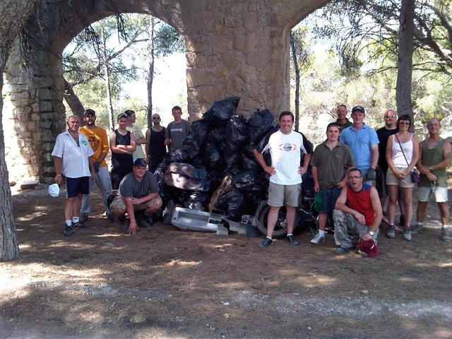 Ross Honey (pictured centre white t-shirt) and team at the River Ebro in 2011 with just some of the 52 tonnes of rubbish collected.