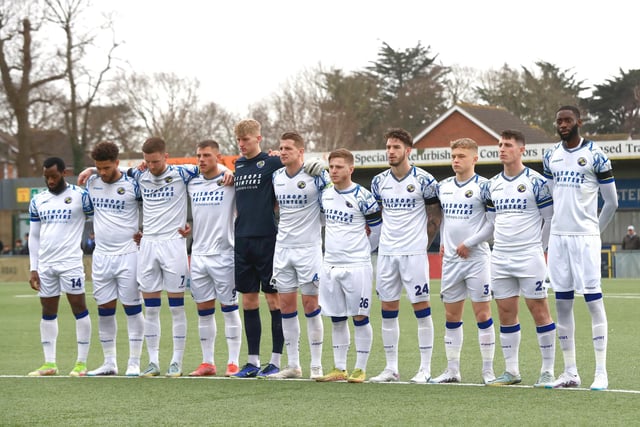 The Hawks team observe a minute's silence for former National League president Brian Lee. Picture by Dave Haines
