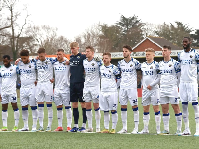 The Hawks team observe a minute's silence for former National League president Brian Lee. Picture by Dave Haines