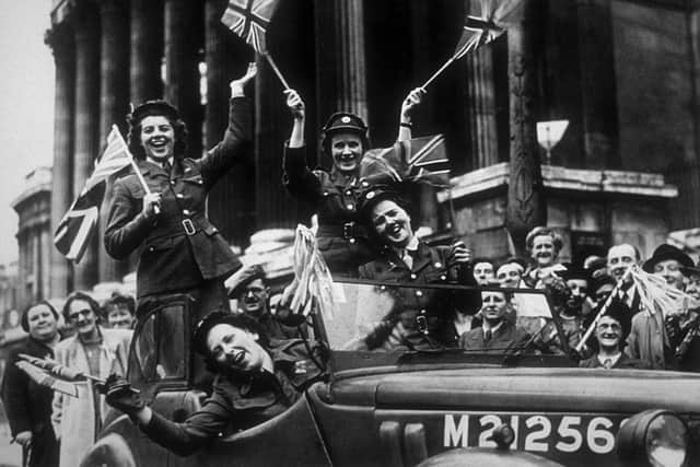 Members of the Auxiliary Territorial Service, driving through Trafalgar Square in a service vehicle during the VE Day celebrations in London 1945 (Photo: R J Salmon/Fox Photos/Hulton Archive/Getty Images)