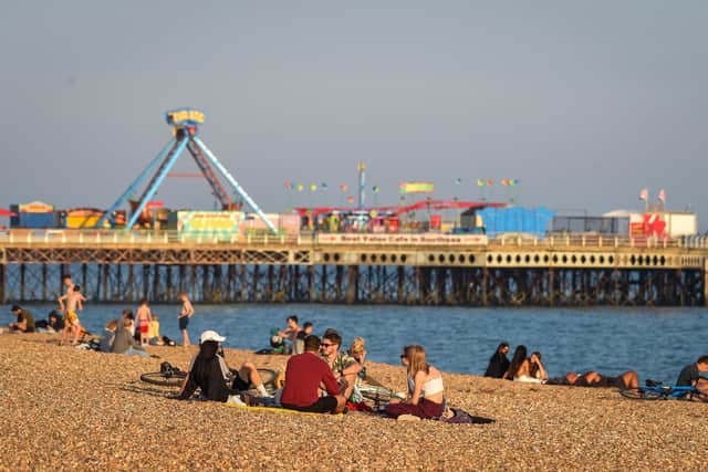 People enjoy the evening sunshine on Southsea beach on September 21, 2020 in Portsmouth, England. (Photo by Finnbarr Webster/Getty Images)
