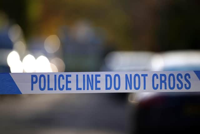 Police scene: Peter Byrne/PA Wire