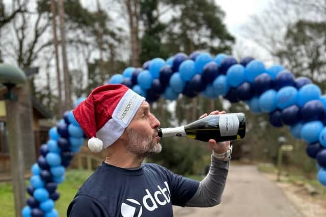 Simon celebrating finishing his challenge
